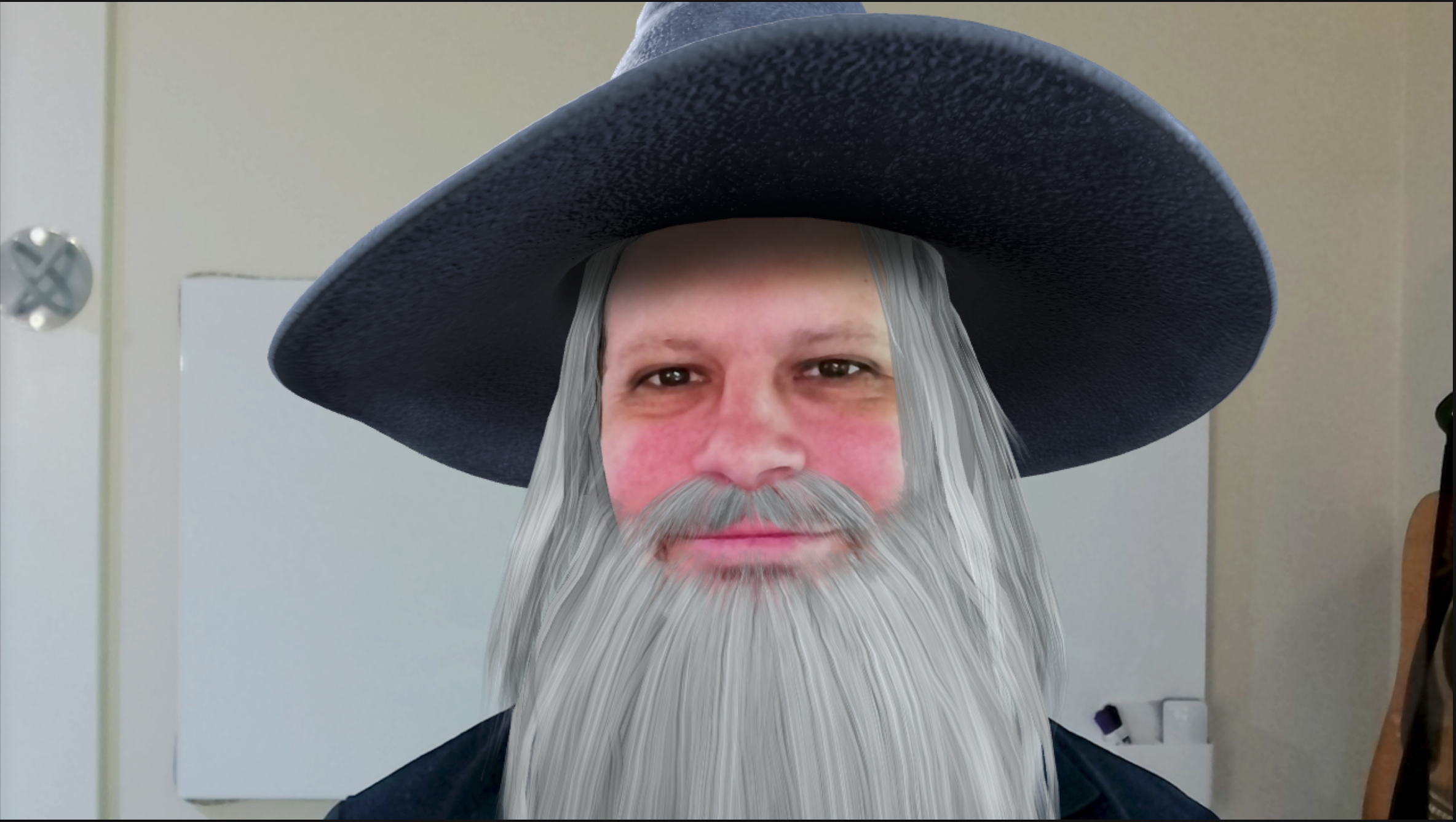 Person with a google meet filter of a wizard